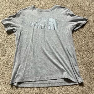 The North Face T-shirt. Gray with silver wording. Great condition!